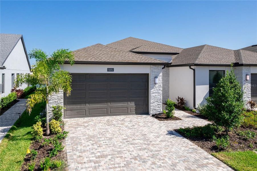 Front exterior of a new home in , Apollo Beach, FL, highlighting curb appeal (Image 18).