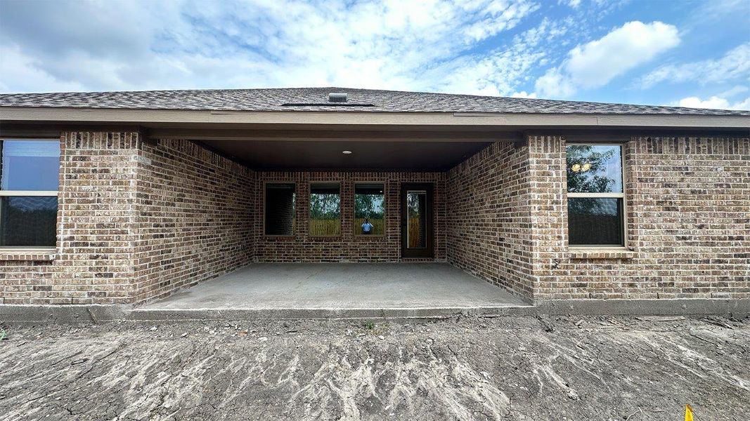 Exterior details and patio area of a home in The Lakes Northwest, Robstown (Image 25).
