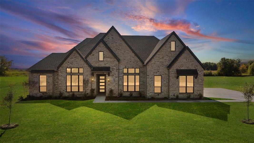 Front exterior of a new home in Levante - 1 Acre Lots, Waxahachie, TX, highlighting curb appeal (Image 1). Front exterior of a new home in Levante - 1 Acre Lots, Waxahachie, TX, highlighting curb appeal (Image 1).