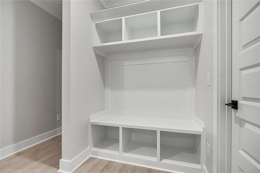 A built-in bench and storage cubbies create a func A built-in bench and storage cubbies create a func