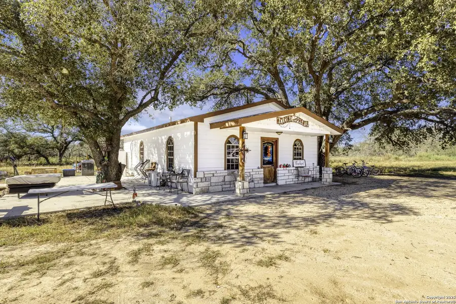 Exterior details and patio area of a home in , Devine (Image 1).