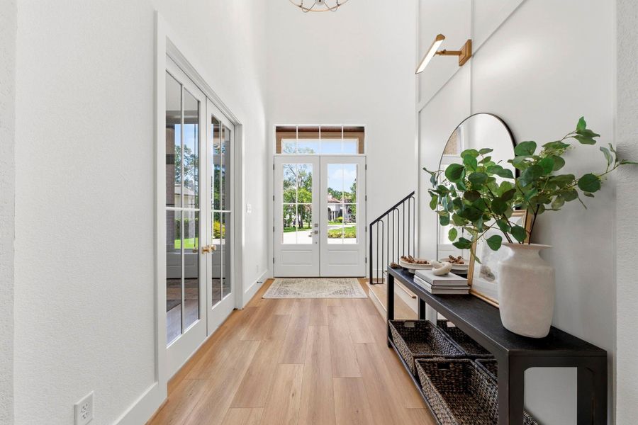 Such an inviting entry with custom trim and lighting details. Such an inviting entry with custom trim and lighting details.