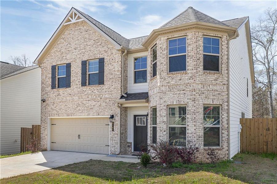 Front exterior of a new home in , Conley, GA, highlighting curb appeal (Image 2). Front exterior of a new home in , Conley, GA, highlighting curb appeal (Image 2).