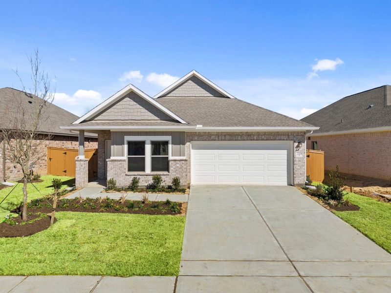 Front exterior of a new home in Cypress Green, Hockley, TX, highlighting curb appeal (Image 24).