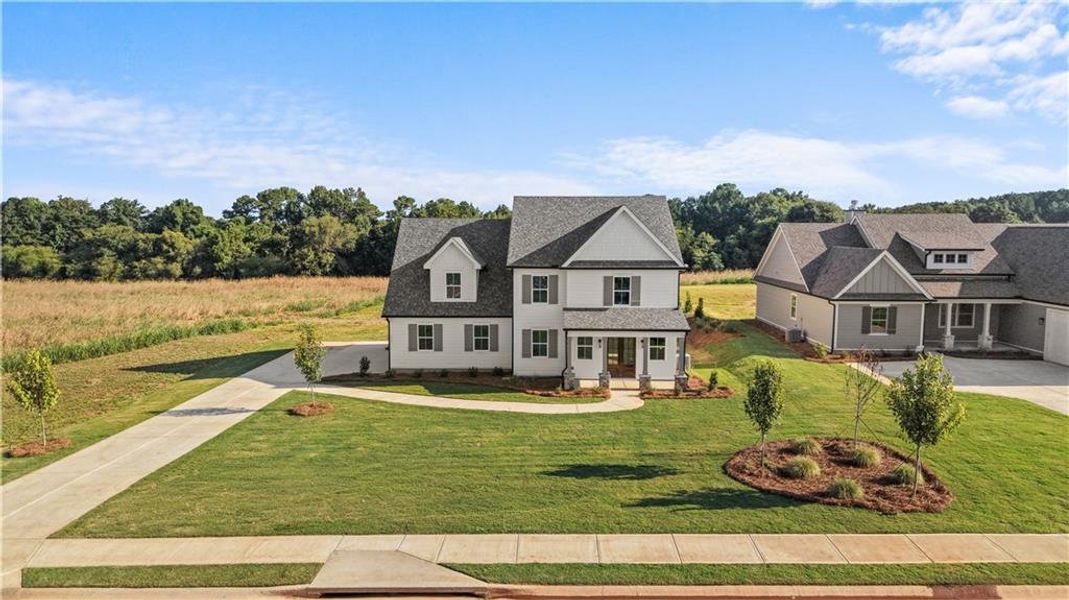 Front exterior of a new home in , Madison, GA, highlighting curb appeal (Image 31). Front exterior of a new home in , Madison, GA, highlighting curb appeal (Image 31).