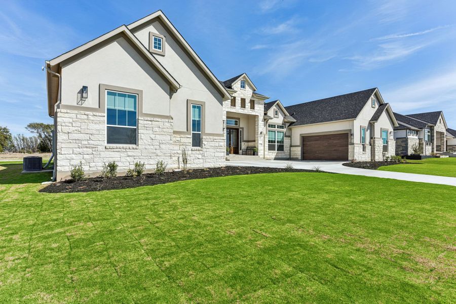 Front exterior of a new home in Feathergrass, Florence, TX, highlighting curb appeal (Image 27).