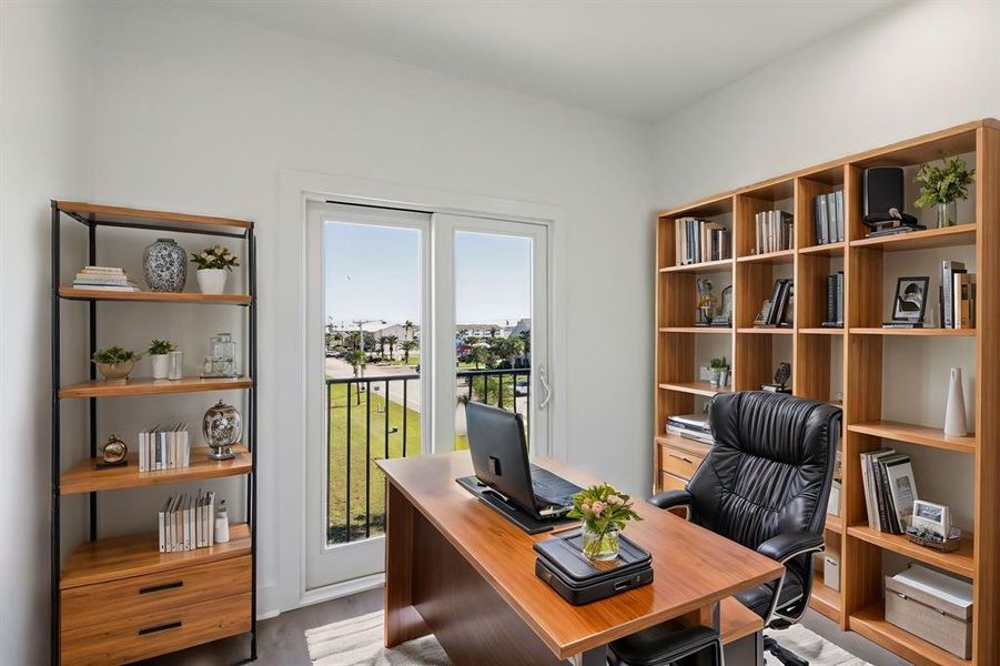 Another one of the secondary bedrooms that is staged to look like an office to show how this space could be used