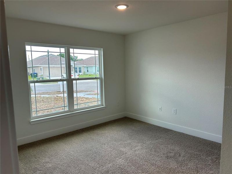 Spacious, unfurnished interior of a new home in Watercress Cove, North Port (Image 11).