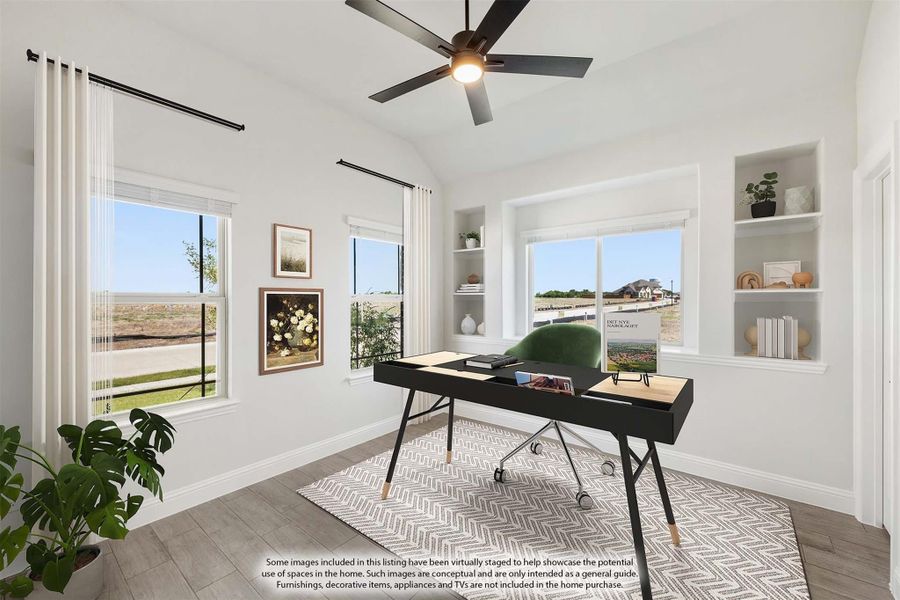 Home office with vaulted ceiling, built-in shelves, ceiling fan, and large windows with open views