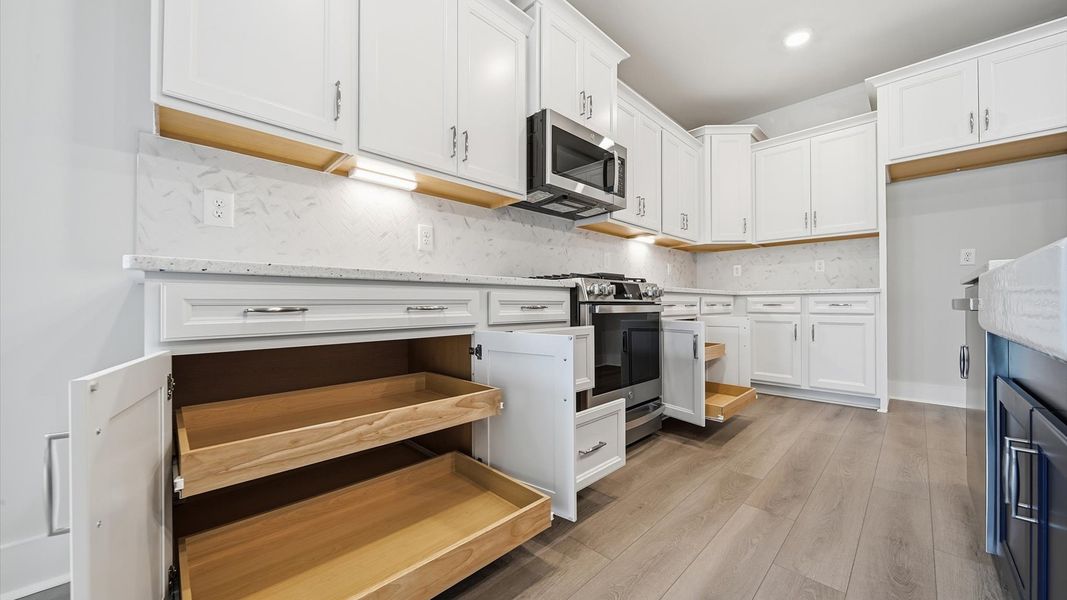 Well-designed kitchen with abundant storage and tasteful finishes that elevate everyday living at Creeks at Midway