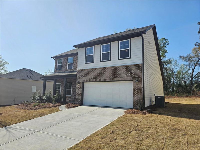 Front exterior of a new home in The Estates at Casteel, Bethlehem, GA, highlighting curb appeal (Image 8).