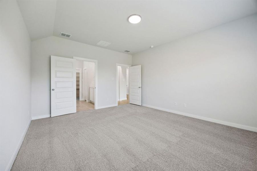 Primary Suite in the Heisman home plan by Trophy Signature Homes – REPRESENTATIVE PHOTO