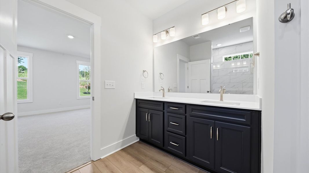 Tasteful primary bath with modern finishes and a thoughtful double vanity layout