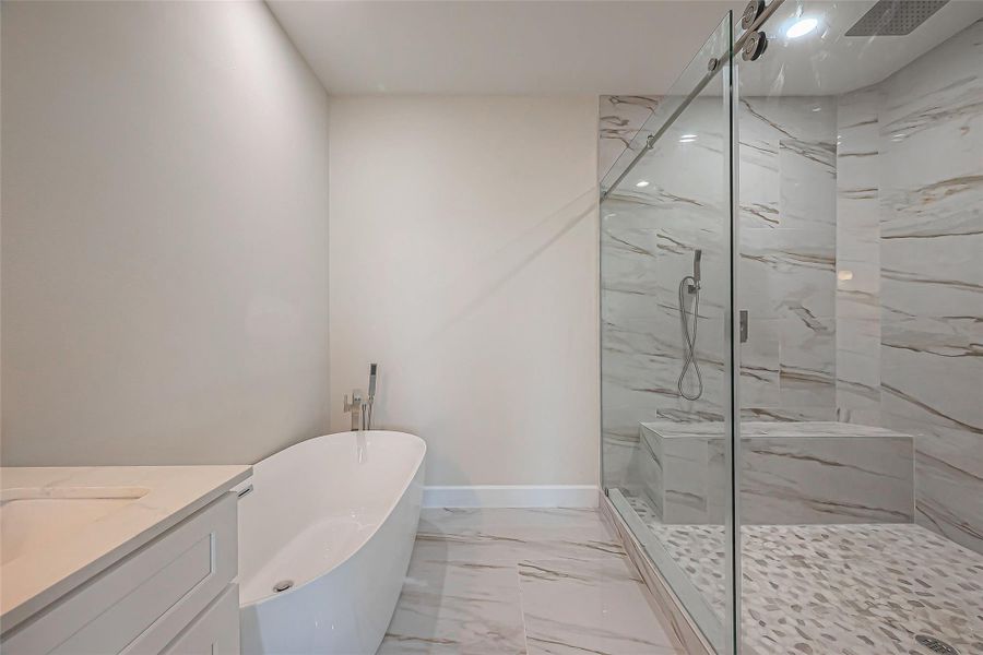 Unit 2: Primary ensuite with double vanity, huge walk in showere with double shower heads and soaking tub.