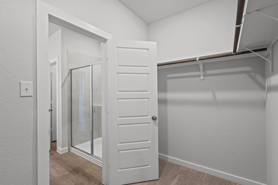 A white closet in a room.