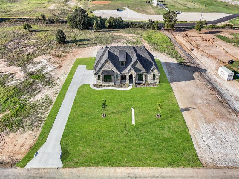 Front exterior of a new home in , Weatherford, TX, highlighting curb appeal (Image 32).