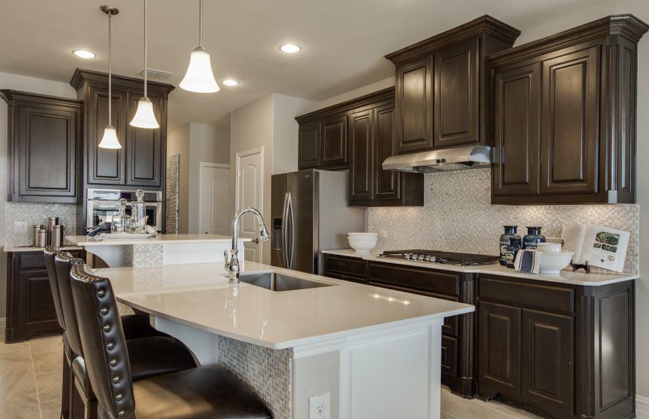 Island kitchen with eat-in bartop, with your choice of granite or quartz countertops