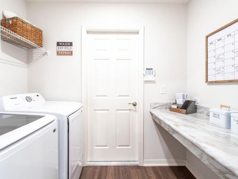 A built-in drop zone helps corral clutter and keep it off the kitchen counter - Paisley home plan by Highland Homes