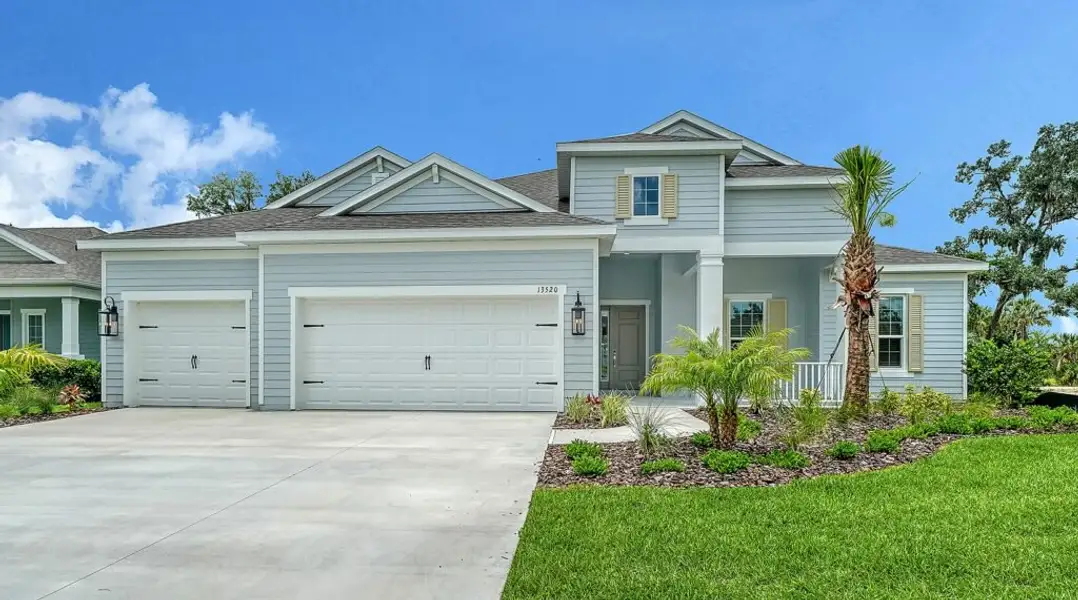 Front exterior of a new home in Canoe Creek, Parrish, FL, highlighting curb appeal (Image 1). Front exterior of a new home in Canoe Creek, Parrish, FL, highlighting curb appeal (Image 1).