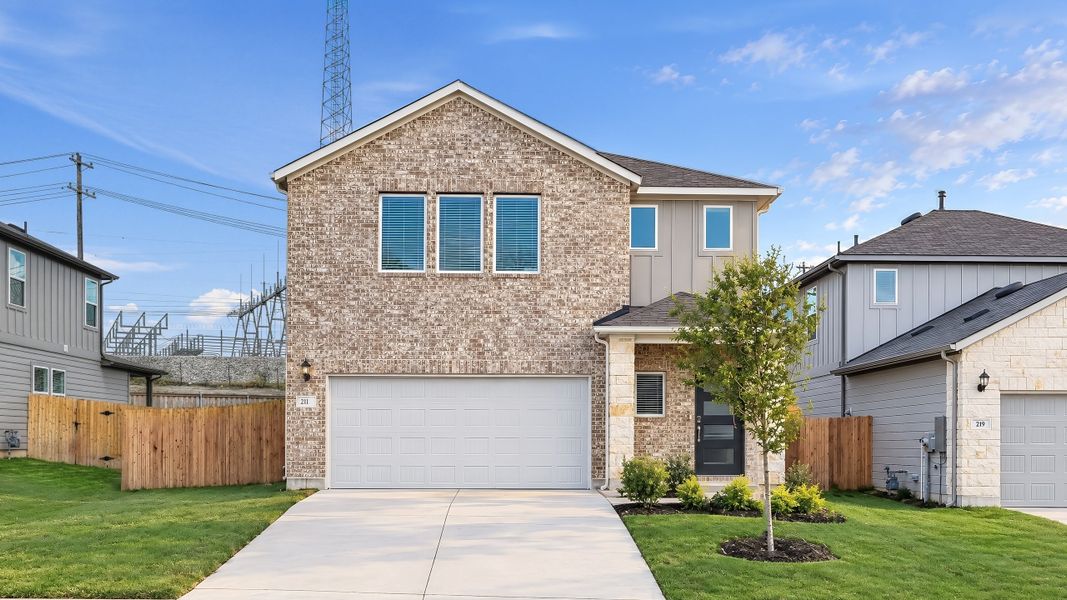 Front exterior of a new home in Sunfield, Buda, TX, highlighting curb appeal (Image 24).