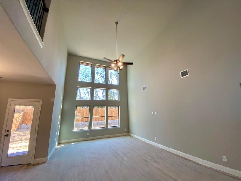 Look at this amazing wall of windows with view of large trees!