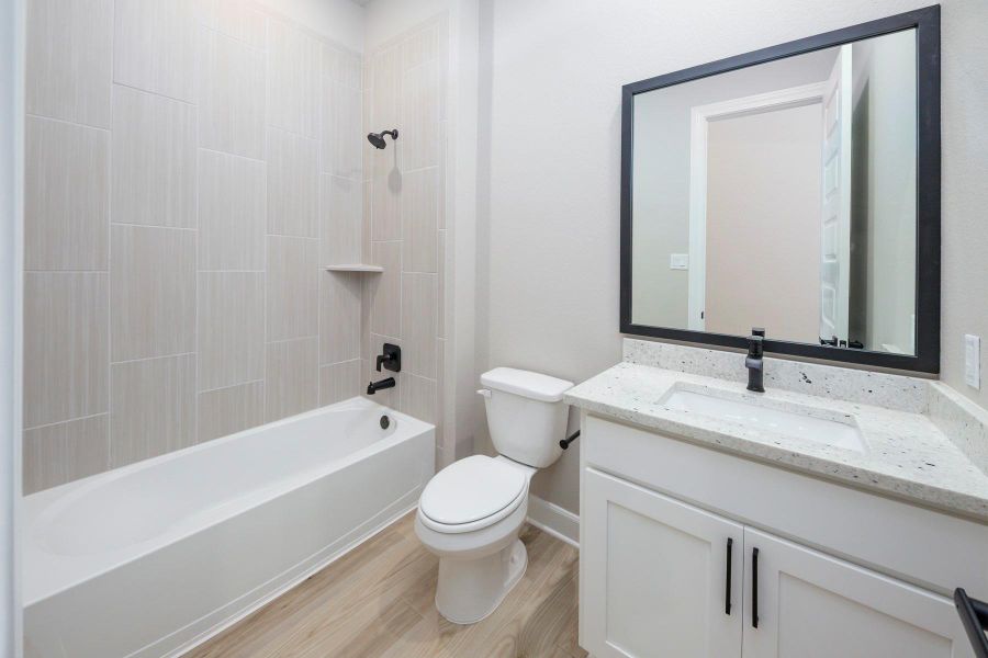 The secondary bathrooms are located centrally to the bedrooms and include tiled showers. The secondary bathrooms are located centrally to the bedrooms and include tiled showers.