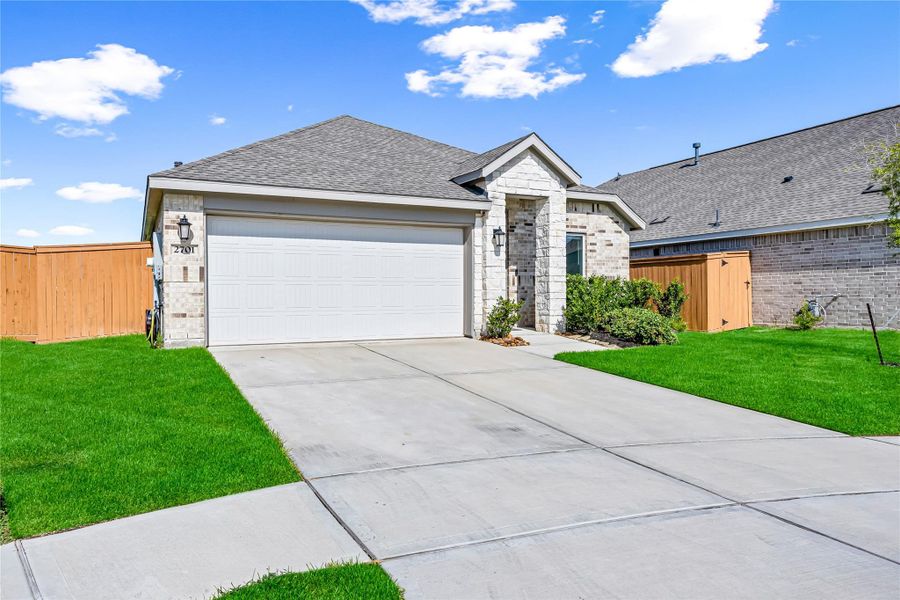 Front exterior of a new home in Lago Mar, Texas City, TX, highlighting curb appeal (Image 2).