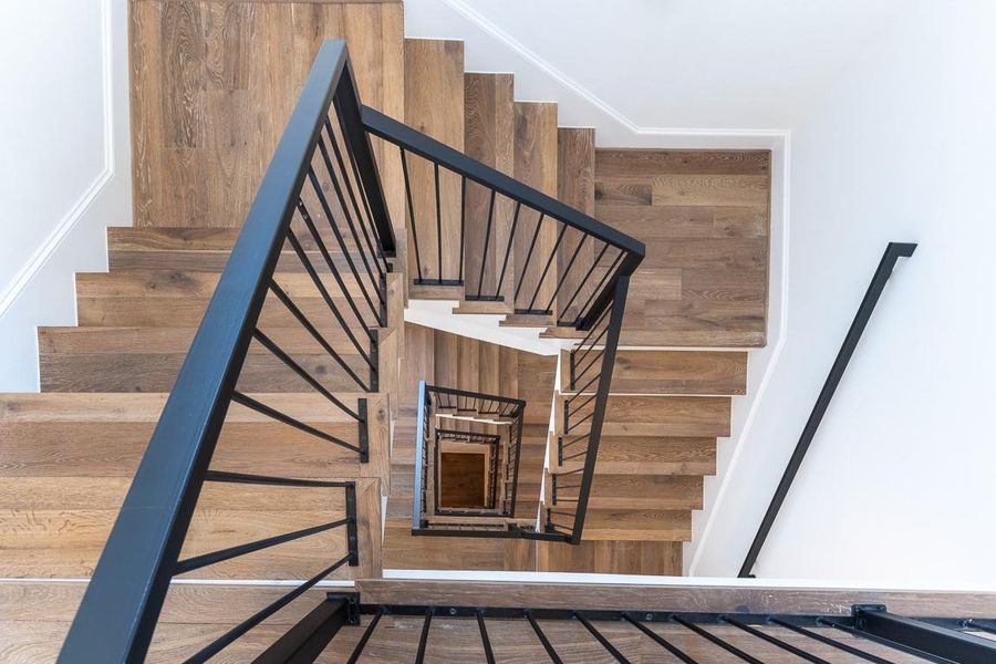 Open staircase all the way up with wonderful natural light. Open staircase all the way up with wonderful natural light.