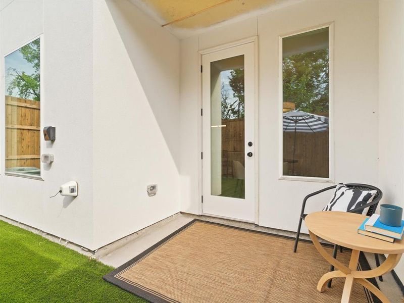 Property entrance with stucco siding Property entrance with stucco siding