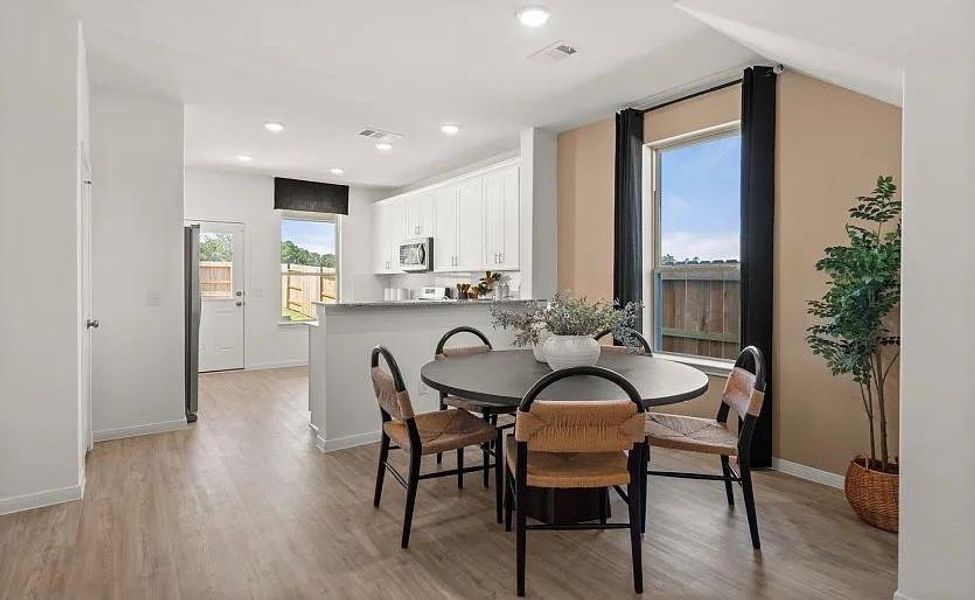 Furnished interior view inside a new home in The Pines At Seven Coves, Willis (Image 3).