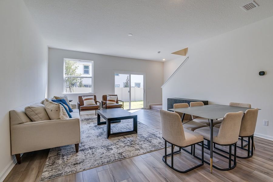 Furnished interior in a model home at Orchard Park Townhomes in St. Augustine (Image 8).