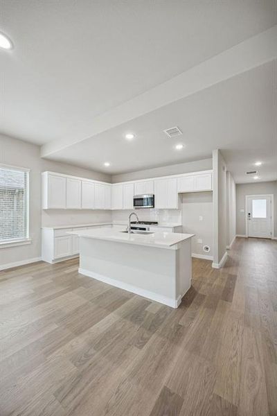 Kitchen in the Stanley II home plan by Trophy Signature Homes – REPRESENTATIVE PHOTO