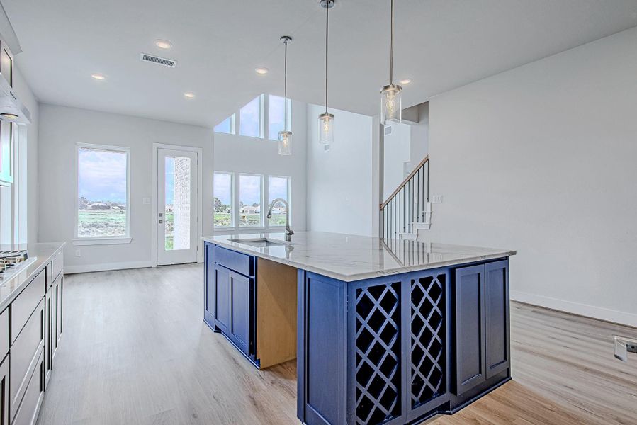 A peek around the island reveals a built-in wine rack and extended prep space, perfect for hosting, entertaining, or everyday meals. A peek around the island reveals a built-in wine rack and extended prep space, perfect for hosting, entertaining, or everyday meals.