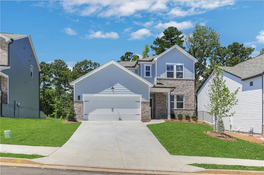 Front exterior of a new home in Cambridge at Steels Bridge, Canton, GA, highlighting curb appeal (Image 16).