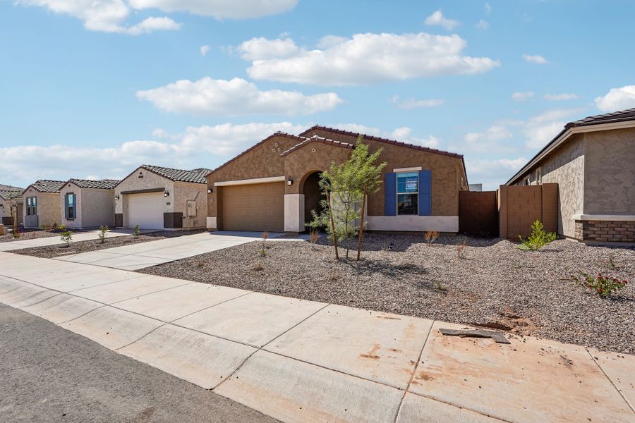 Front exterior of a new home in Hawes Crossing, Mesa, AZ, highlighting curb appeal (Image 25).