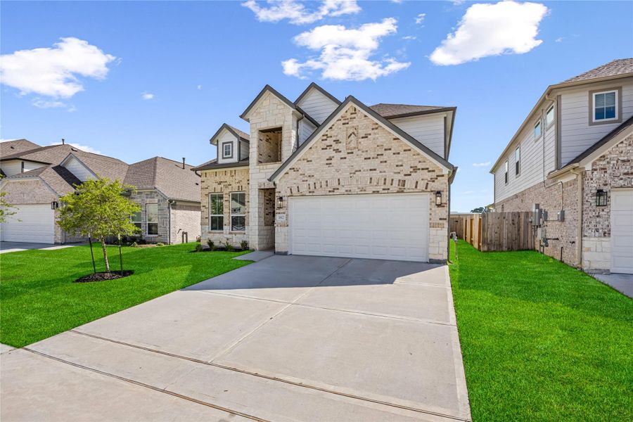 Front exterior of a new home in Champions Oak, Houston, TX, highlighting curb appeal (Image 21). Front exterior of a new home in Champions Oak, Houston, TX, highlighting curb appeal (Image 21).