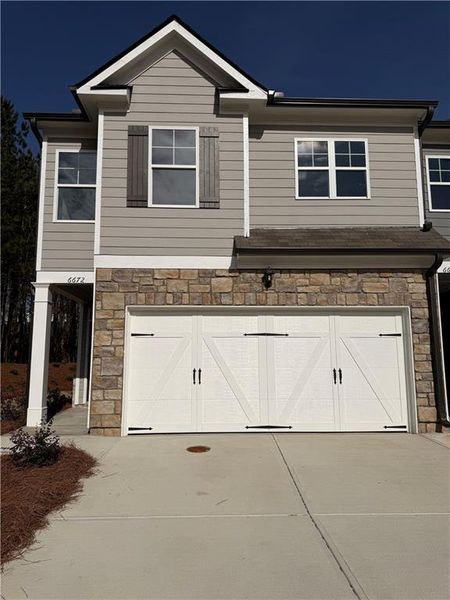 Front exterior of a new home in Waypoint, Flowery Branch, GA, highlighting curb appeal (Image 20).