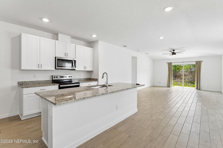Furnished interior view inside a new home in Lakes at Bella Lago – Classic Series, Green Cove Springs (Image 9).