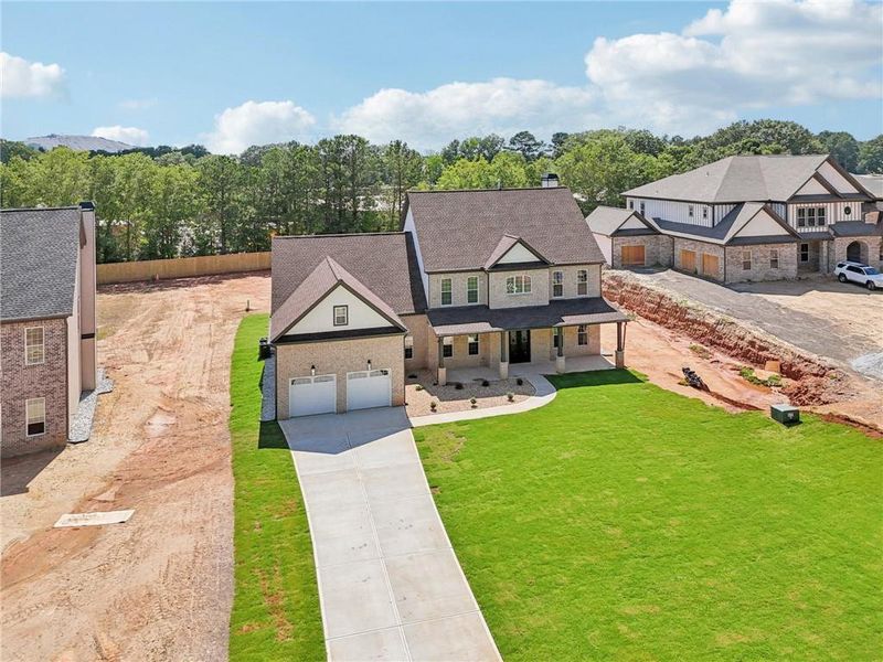 Front exterior of a new home in , Lilburn, GA, highlighting curb appeal (Image 32).