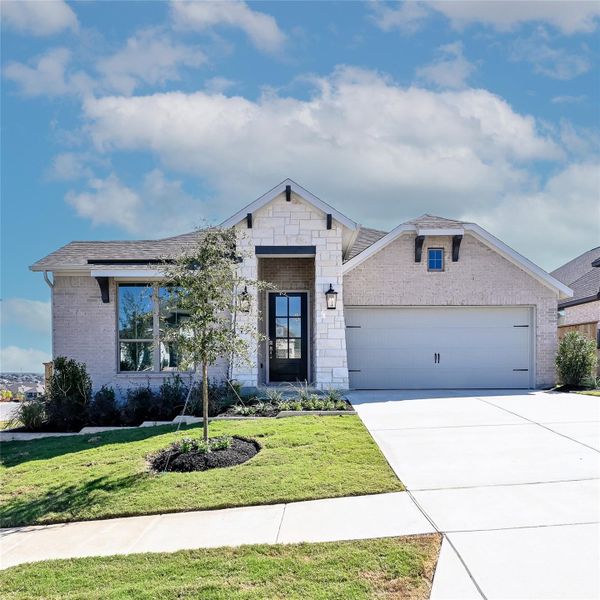 Front exterior of a new home in La Cima 50', San Marcos, TX, highlighting curb appeal (Image 2). Front exterior of a new home in La Cima 50', San Marcos, TX, highlighting curb appeal (Image 2).