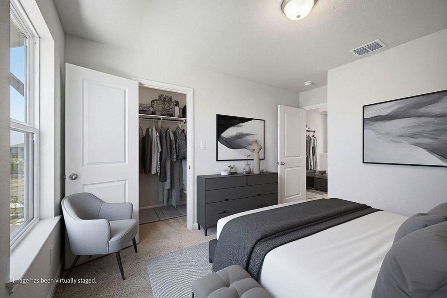 A spacious bedroom offers plush carpeting, a built-in closet, and abundant natural light. A spacious bedroom offers plush carpeting, a built-in closet, and abundant natural light.