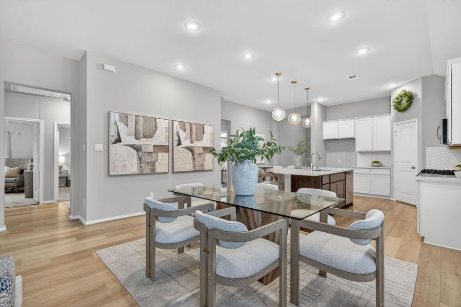 Another view of the dining room looking toward the kitchen. The layout is bright and inviting, perfect for entertaining. Another view of the dining room looking toward the kitchen. The layout is bright and inviting, perfect for entertaining.