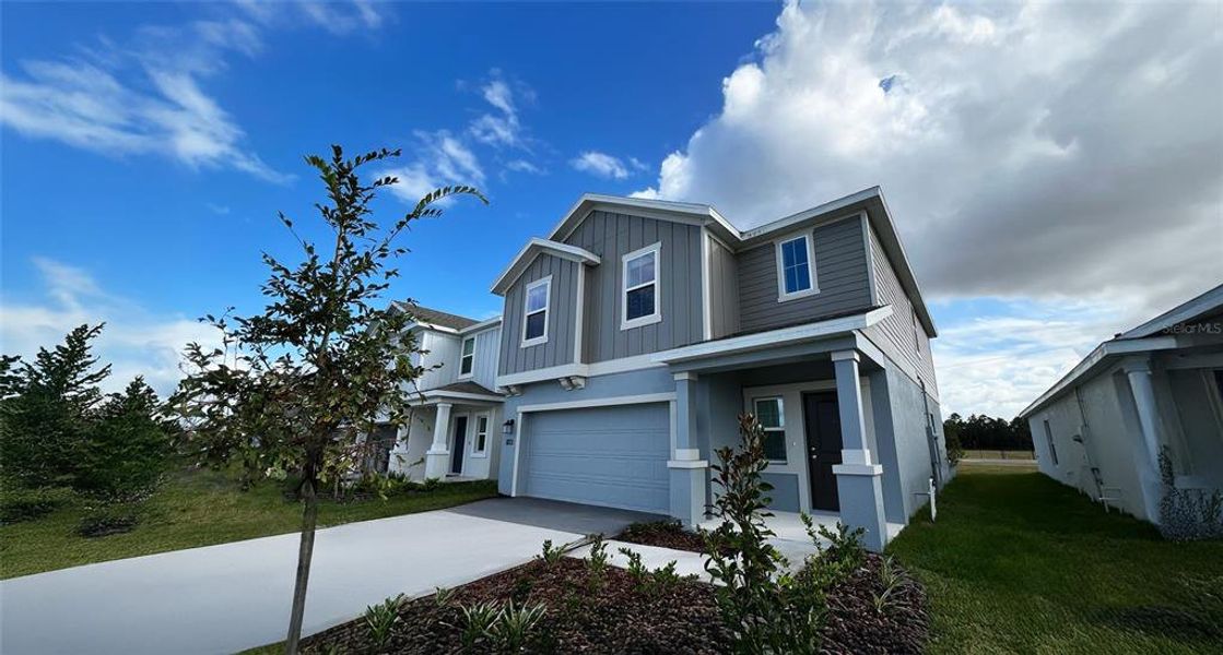 Front exterior of a new home in , Winter Haven, FL, highlighting curb appeal (Image 20).