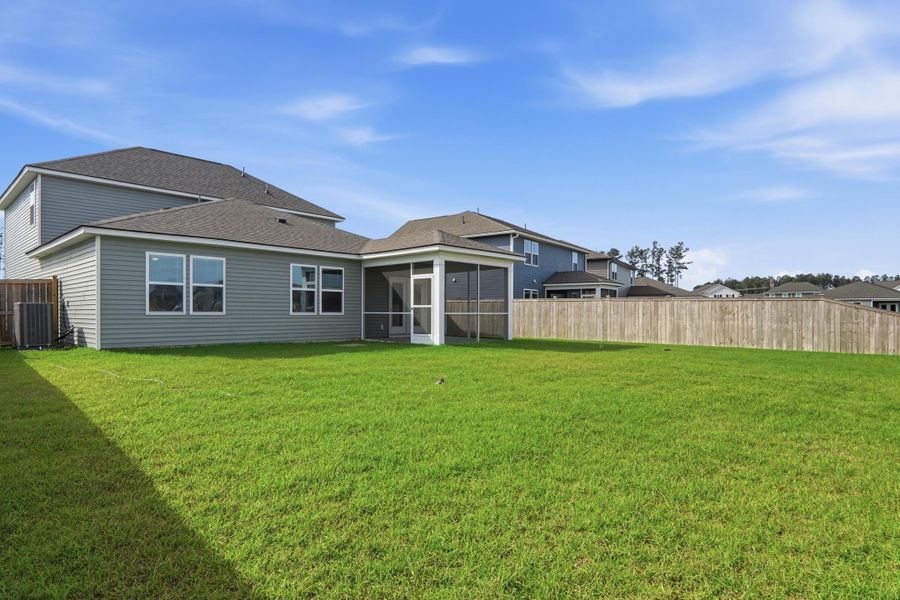 Exterior details and patio area of a home in Sanctuary Cove at Cane Bay, Summerville (Image 29).