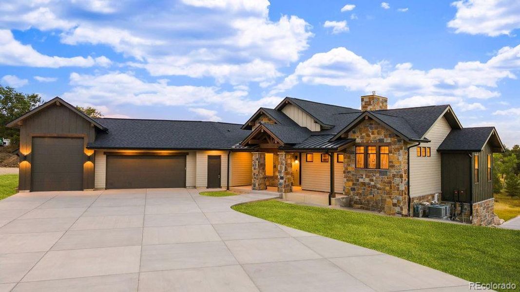 Front exterior of a new home in , Parker, CO, highlighting curb appeal (Image 24).
