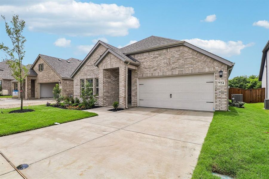 Front exterior of a new home in Elevon, Lavon, TX, highlighting curb appeal (Image 15). Front exterior of a new home in Elevon, Lavon, TX, highlighting curb appeal (Image 15).