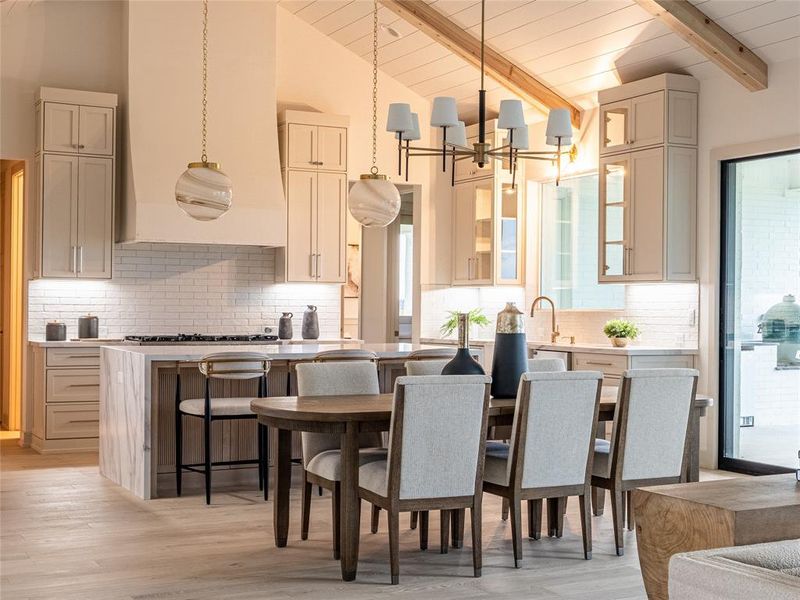 Dining space with light wood-style floors, a chandelier, and wood ceiling