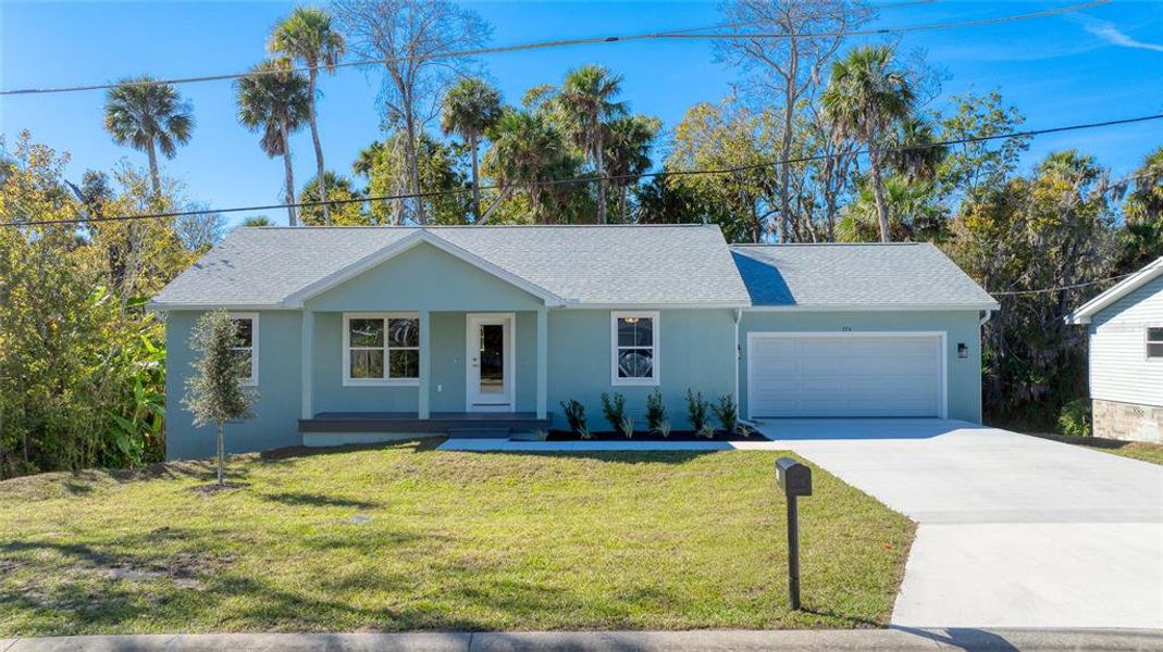 Front exterior of a new home in , Ormond Beach, FL, highlighting curb appeal (Image 27).