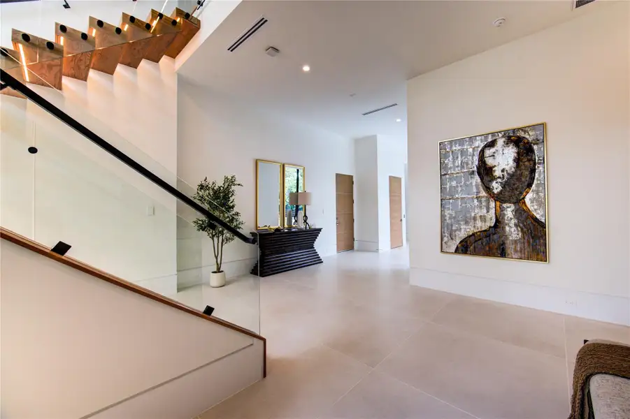 Floating staircase with architectural light well.