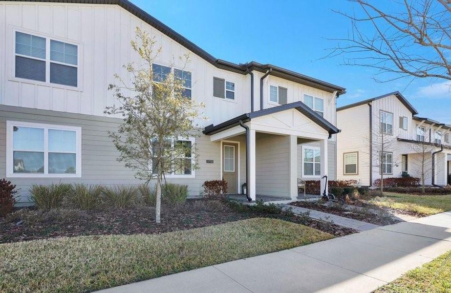 Front exterior of a new home in Northlake at Ovation, Winter Garden, FL, highlighting curb appeal (Image 21).